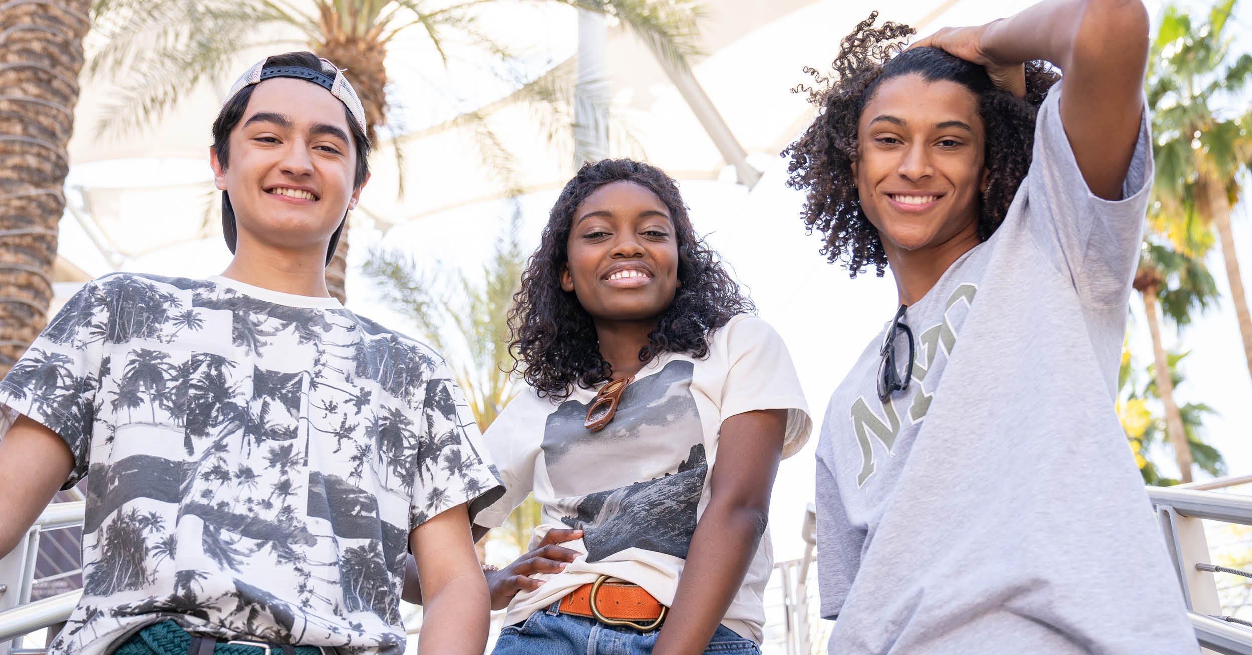 Three teens smiling summer